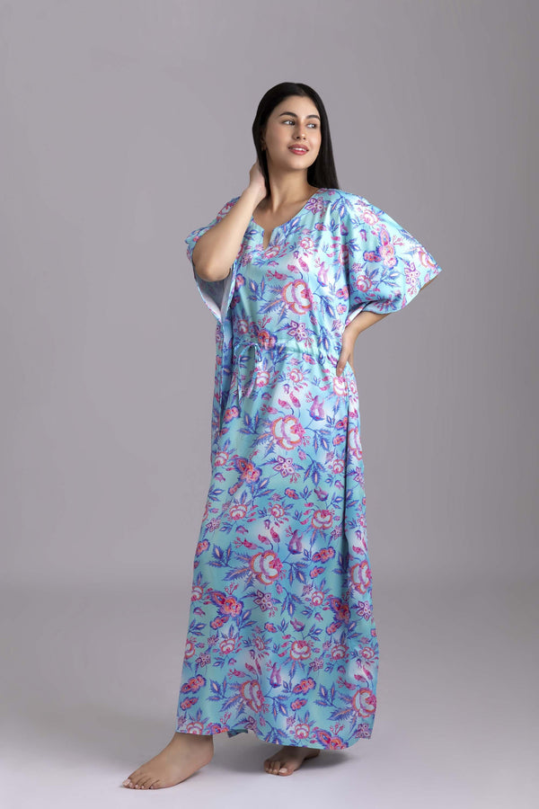 Urmi-The Ocean  Fabric-Poly satin  The kaftan is an  ankle length long dress with flowy sleeves, made from smooth man made fibre, with a drawstring at the waist. It's free size and comfortable to lounge in.
