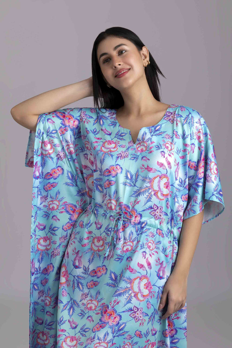 Urmi-The Ocean  Fabric-Poly satin  The kaftan is an  ankle length long dress with flowy sleeves, made from smooth man made fibre, with a drawstring at the waist. It's free size and comfortable to lounge in.