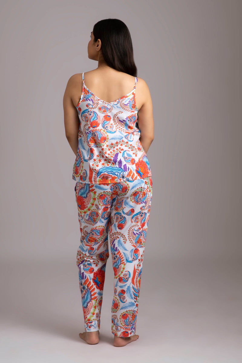 Naina-Eyes  Fabric-Cotton satin  Style-Charming   Our playful night suit set is made and trimmed from serene cotton  and is perfect to lounge in. It has a playful yet curious camisole and coordinated smart pants have an elasticated waistband with a drawstring for added comfort.  