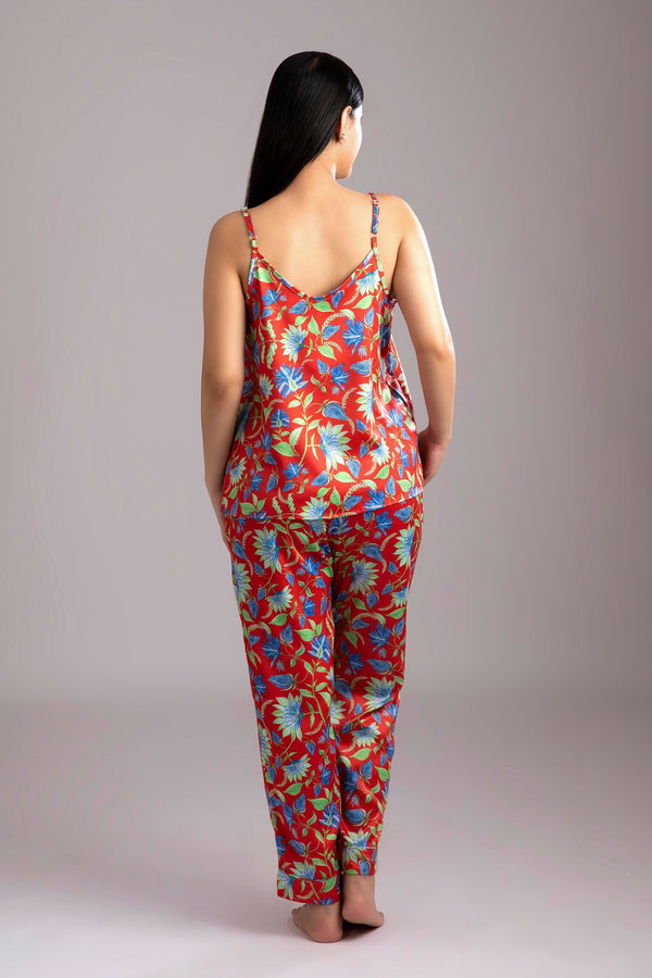 Rina-Beloved  Fabric-Poly satin  Style-Charming  Our playful night suit set is made and trimmed from smooth man made fibre and is perfect to lounge in. It has a playful yet curious camisole and coordinated smart pants have an elasticated waistband with a drawstring for added comfort. 