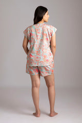 Naina-Eyes  Fabric-Cotton satin  Style-Chic  Our short  sleeved night suit set is made and trimmed from serene cotton and is perfect to lounge in. It has a relaxed silhouette top and coordinated elegant shorts  with an elasticated waistband with a drawstring adding meaning to comfort and relaxation. 