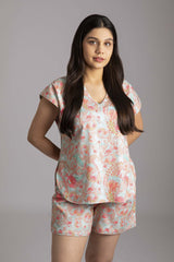 Naina-Eyes  Fabric-Cotton satin  Style-Chic  Our short  sleeved night suit set is made and trimmed from serene cotton and is perfect to lounge in. It has a relaxed silhouette top and coordinated elegant shorts  with an elasticated waistband with a drawstring adding meaning to comfort and relaxation. 