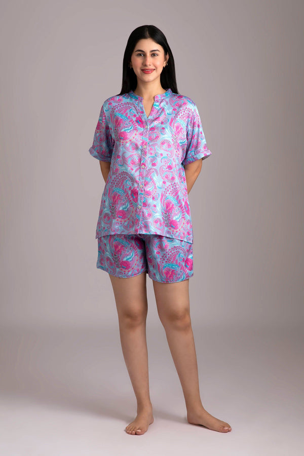 Naina-Eyes  Fabric-Poly satin  Style-Urban  Our half sleeve night suit with a notched round neck is made from smooth man made fibre and is coordinated with elegant shorts which have an elasticated waistband with a drawstring adding meaning to comfort and relaxation. 