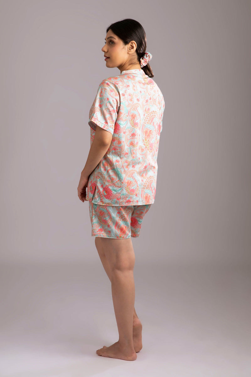 Naina-Eyes  Fabric-Cotton satin  Style-Urban  Our half sleeve night suit with a notched round neck is made from serene cotton and is coordinated with elegant shorts which have an elasticated waistband with a drawstring adding meaning to comfort and relaxation. 
