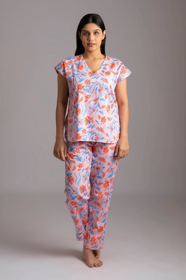 Rina-Beloved  Fabric-Cotton satin  Style-Voguish  Our short sleeved night suit is made and trimmed from serene cotton and is perfect to lounge in. It has a relaxed silhouette top and coordinated smart pants have an elasticated waistband with a drawstring for added comfort. 