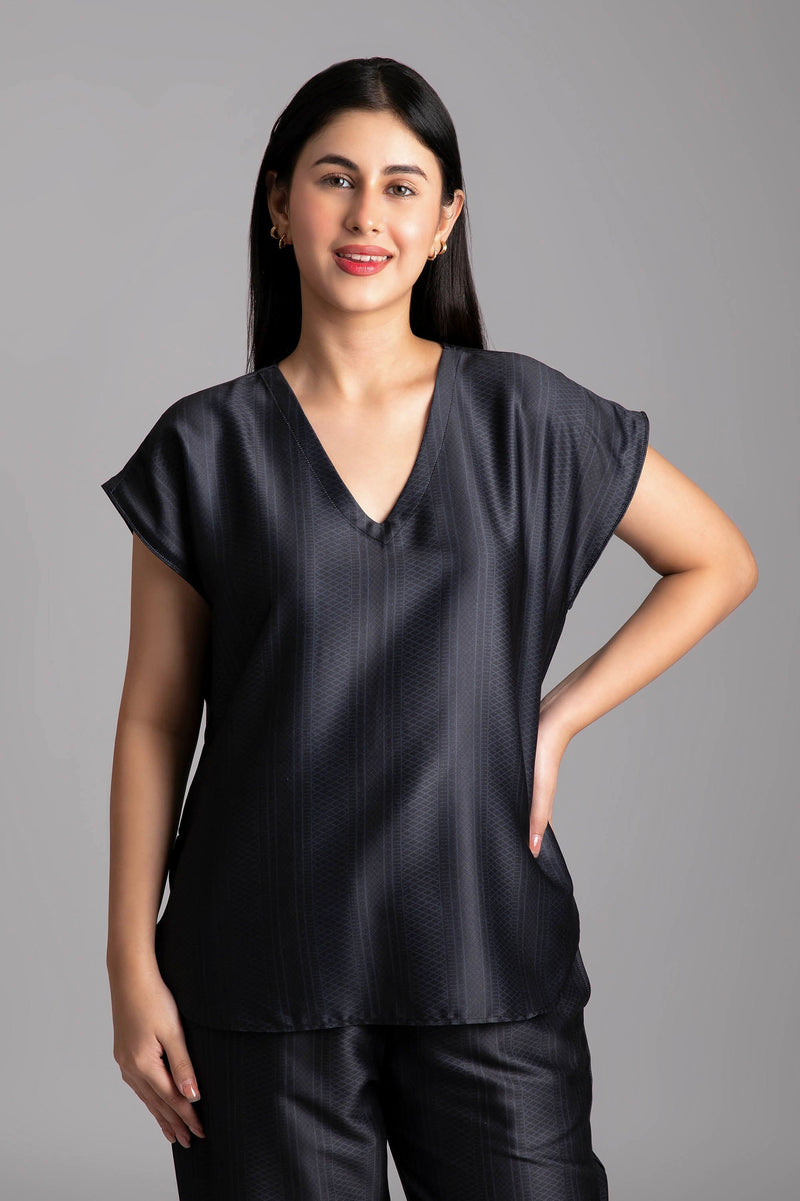 Shia-Gift from god  Fabric-Poly satin  Style-Voguish  Our short sleeved night suit is made and trimmed from smooth man made fibre  and is perfect to lounge in. It has a relaxed silhouette top and coordinated smart pants have an elasticated waistband with a drawstring for added comfort. 