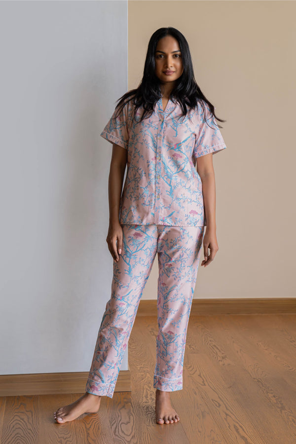 Our half sleeve night suit with a notched round neck is made from serene cotton and is coordinated with  smart pants that have an elasticated waistband with a drawstring for added comfort. 