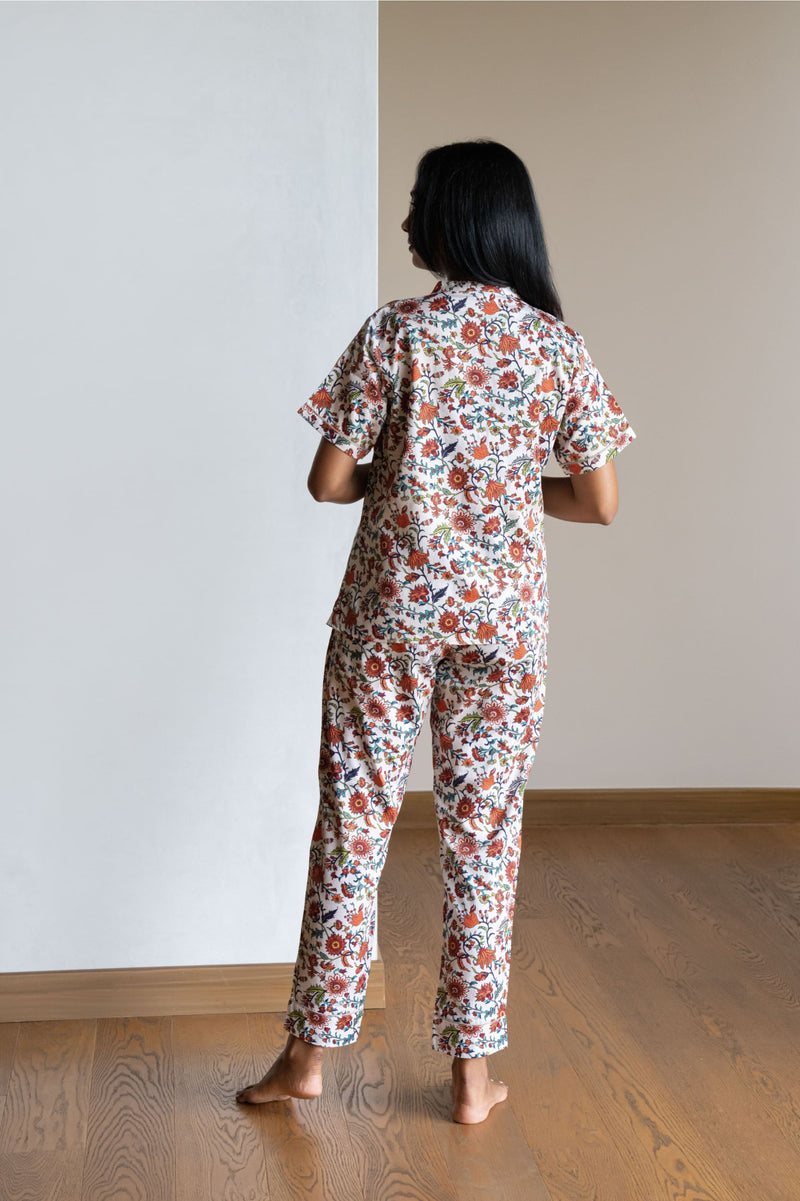 Our half sleeve night suit with a notched round neck is made from serene cotton and is coordinated with smart pants that have an elasticated waistband with a drawstring for added comfort.