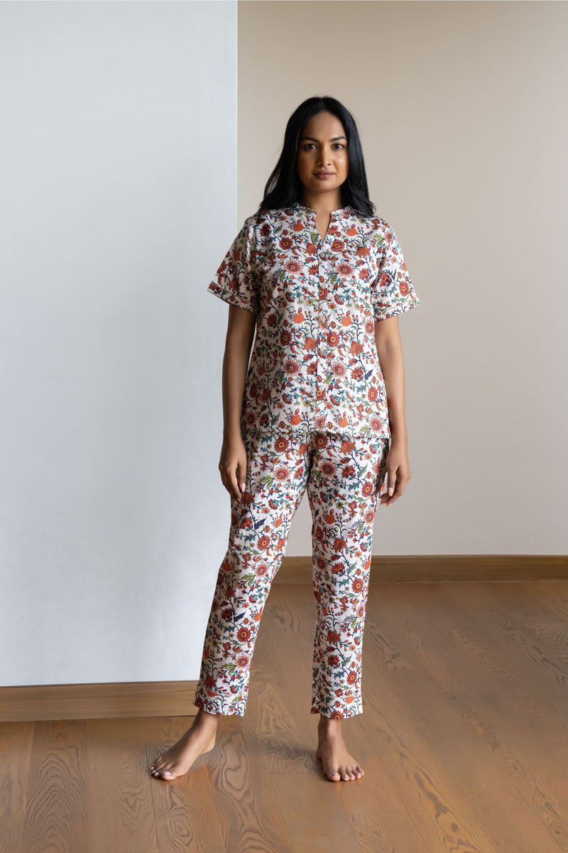 Our half sleeve night suit with a notched round neck is made from serene cotton and is coordinated with smart pants that have an elasticated waistband with a drawstring for added comfort.