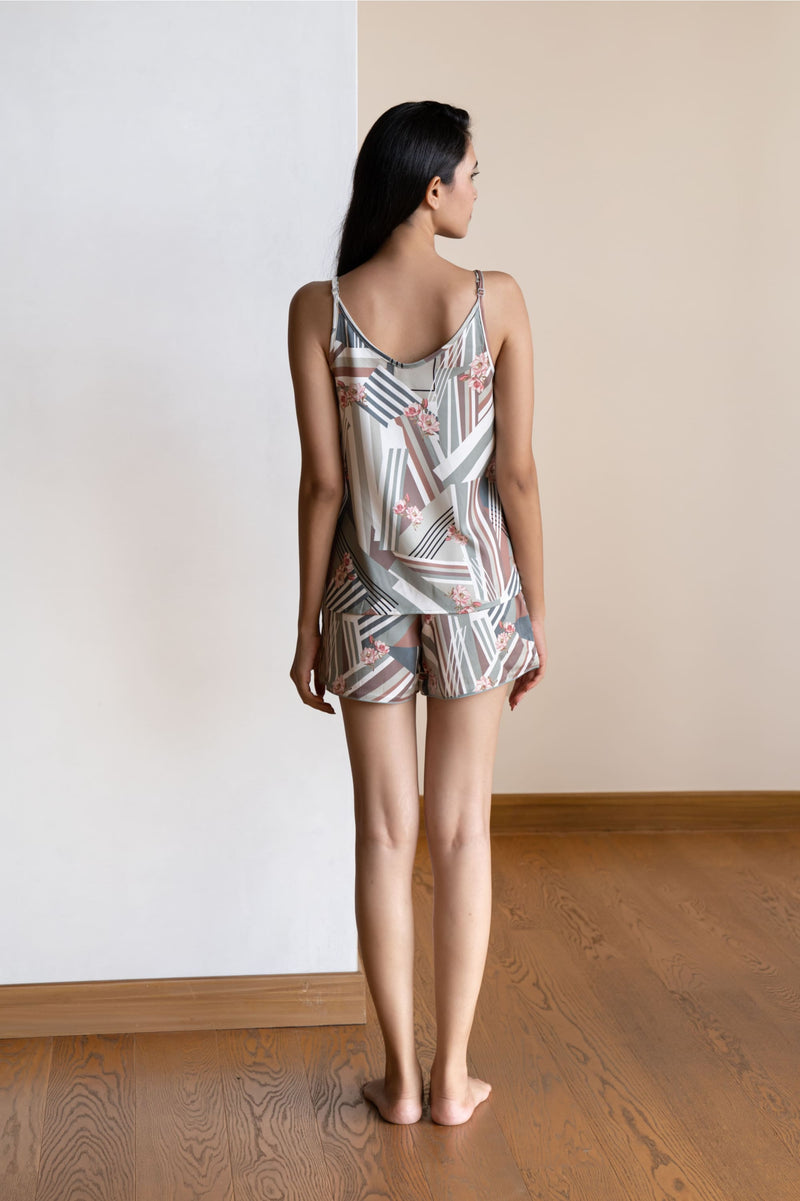This playsuit is perfect for a balmy evening - a cheerful yet curious camisole coordinated with elegant shorts adds meaning to comfort and relaxation.