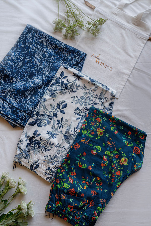 Three pairs of pants in serene cotton in vibrant prints, perfect to lounge in. Comfortable culottes and elegant straight fit pants, with an elasticated waistband with a drawstring adding meaning to comfort and relaxation.