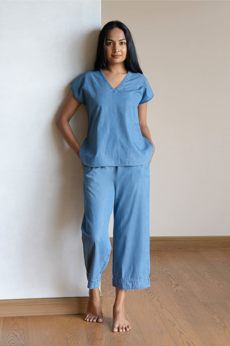 Our short sleeved night suit is made and trimmed from a lightweight cotton denim, which is a breathable soft fabric that is perfect to lounge in. They are soft and will feel like a second skin. It has a relaxed silhouette top and coordinated easy culottes with an elasticated waist band for that extra comfort.