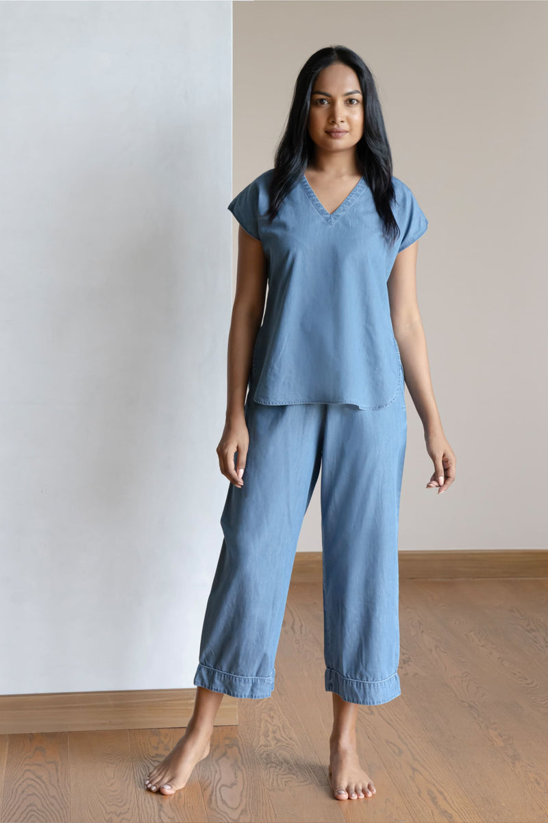Our short sleeved night suit is made and trimmed from a lightweight cotton denim, which is a breathable soft fabric that is perfect to lounge in. They are soft and will feel like a second skin. It has a relaxed silhouette top and coordinated easy culottes with an elasticated waist band for that extra comfort.